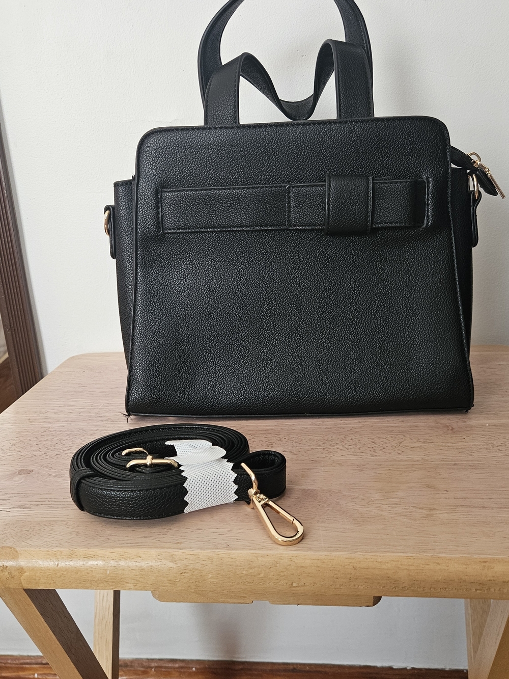 Black Structured Women's Handbag with Detachable Strap.